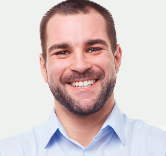 businessman-smiling-portrait-grey-background-800h