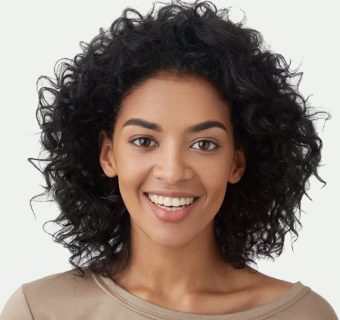 team-member-woman-smiling-portrait-grey-background-800h