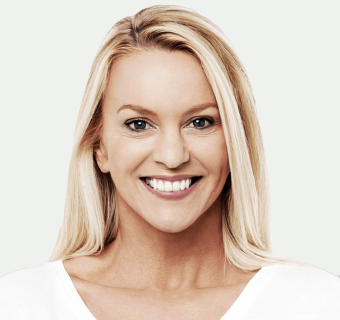 woman-smiling-portrait-grey-background-800h